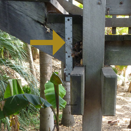 long metal framing strap on side of wood stairway